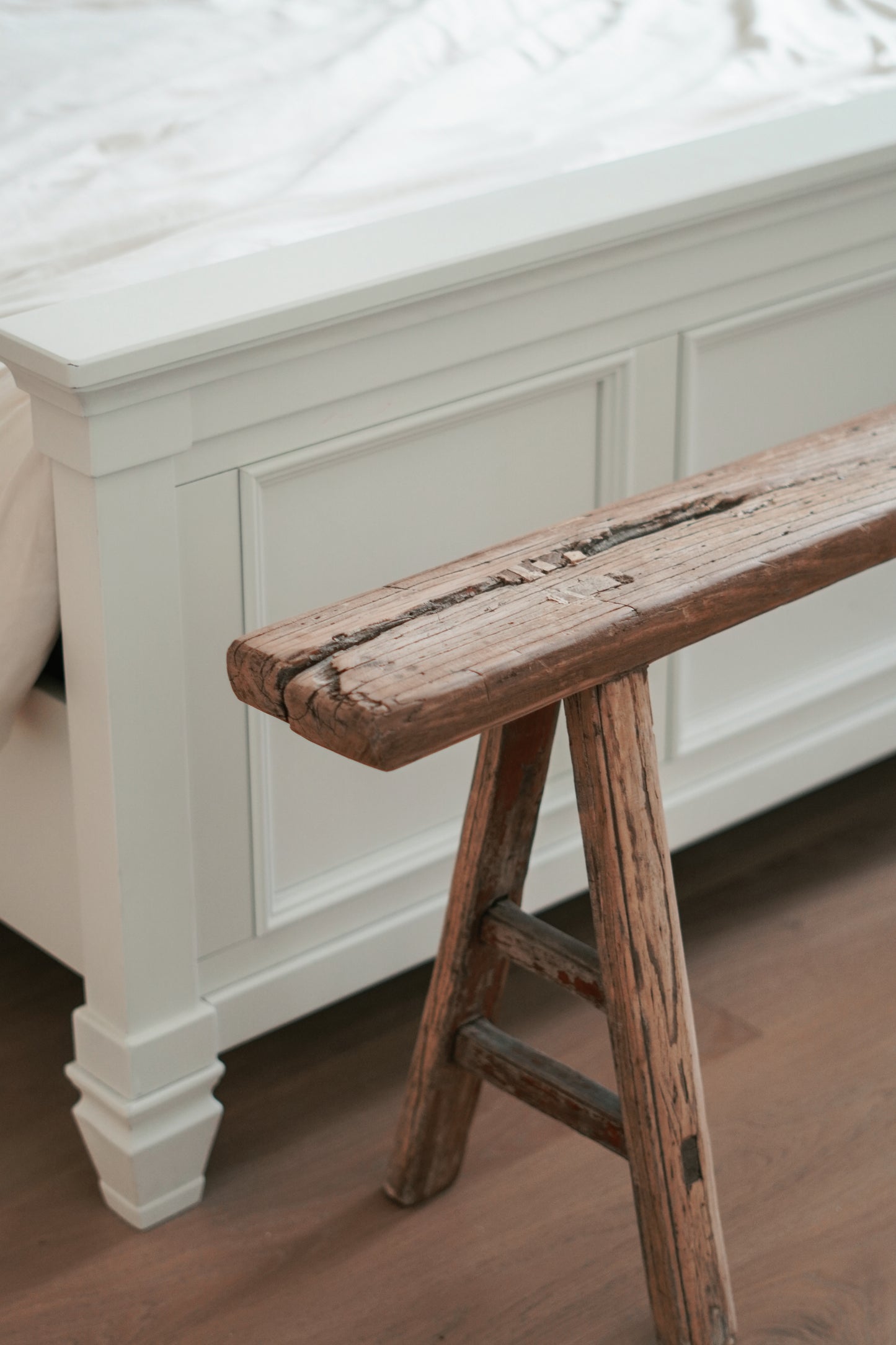 Vintage elm wood benches from China, each with unique grain patterns and a rustic, weathered finish. Perfect for versatile use in wabisabi and farmhouse home settings.